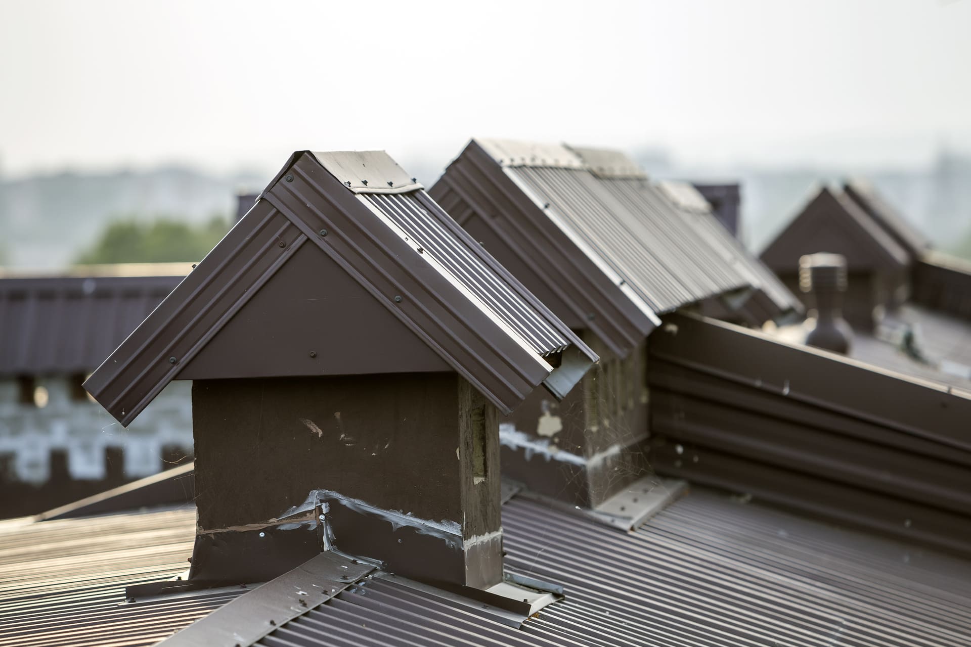 close-up-of-dormer-structures-on-a-metal-roof
