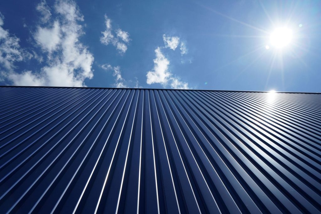 low-angle-shot-of-a-metal-roof-of-a-building