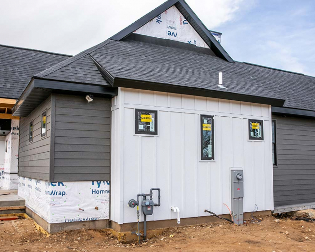 Mastic Board & Batten Siding (Color Brunswick) Prairie Exteriors and